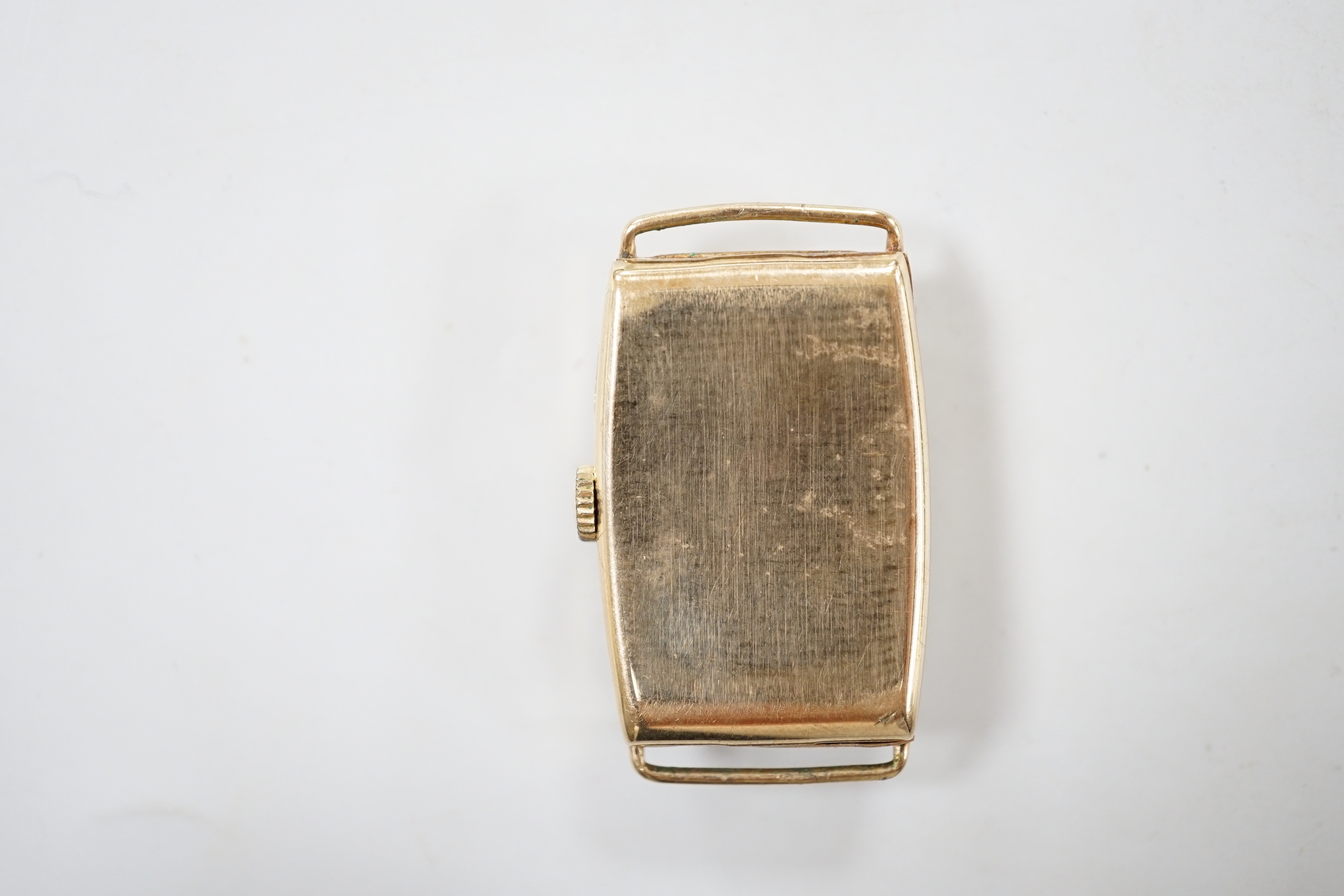 A gentleman's early 1950's 9ct gold J.W. Benson manual wind curved rectangular wrist watch, with Arabic dial and subsidiary seconds, case diameter 22mm, gross weight 16.3 grams, no strap.